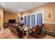 Gathering room featuring comfortable leather seating and a tiled floor at 9680 Ne 25Th Ct, Anthony, FL 32617
