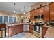 Modern kitchen featuring stainless steel appliances and a breakfast bar at 9680 Ne 25Th Ct, Anthony, FL 32617