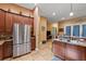 Kitchen with stainless steel refrigerator and island with sink at 9680 Ne 25Th Ct, Anthony, FL 32617