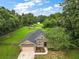 Aerial view of a house with a large backyard, a shed, and a fenced area at 9680 Ne 25Th Ct, Anthony, FL 32617