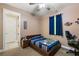 Cozy bedroom with double bed, window, and built-in shelving at 9680 Ne 25Th Ct, Anthony, FL 32617