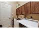 Laundry room with washer, dryer, and cabinets at 9680 Ne 25Th Ct, Anthony, FL 32617