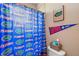 Bathroom with shower and Florida Gators themed decor at 9680 Ne 25Th Ct, Anthony, FL 32617