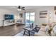Living room with comfortable seating and a TV at 6595 Sw 81St Loop, Ocala, FL 34476