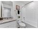 Bathroom with tub shower combo, granite countertop, and white cabinets at 6595 Sw 81St Loop, Ocala, FL 34476