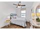 Bedroom with ceiling fan, wood-look floors, and window with a view at 6595 Sw 81St Loop, Ocala, FL 34476