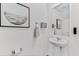 Small powder room with pedestal sink and mirror at 6595 Sw 81St Loop, Ocala, FL 34476