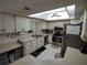 Bright kitchen with stainless steel appliances and skylight at 8750 Sw 116Th Place Rd, Ocala, FL 34481
