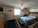 Bright bedroom with wood floors and ceiling fan at 8750 Sw 116Th Place Rd, Ocala, FL 34481