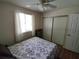 Bedroom with double bed, window, closet, and ceiling fan at 8750 Sw 116Th Place Rd, Ocala, FL 34481