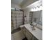 Clean bathroom with shower/tub combo and vanity at 8750 Sw 116Th Place Rd, Ocala, FL 34481