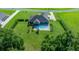 Aerial view of a house with a fenced backyard and pool at 1934 Nw 79Th Loop, Ocala, FL 34475