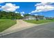 Gray house with driveway and mailbox, surrounded by lush green grass at 1934 Nw 79Th Loop, Ocala, FL 34475