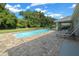 Large pool with patio and lounge chairs at 1934 Nw 79Th Loop, Ocala, FL 34475