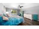 Main bedroom with pool view, large bed, and ample closet space at 1934 Nw 79Th Loop, Ocala, FL 34475