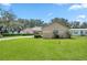 House exterior with well-maintained lawn at 11196 Ne 227Th Place Rd, Fort Mc Coy, FL 32134