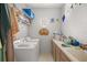 Laundry room with washer, dryer, and utility sink at 11196 Ne 227Th Place Rd, Fort Mc Coy, FL 32134