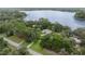 Lakefront home nestled among lush trees at 11196 Ne 227Th Place Rd, Fort Mc Coy, FL 32134