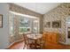 Bright dining room with a large table and lake views at 11196 Ne 227Th Place Rd, Fort Mc Coy, FL 32134