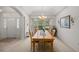 Formal dining room features a wood table and chandelier at 11196 Ne 227Th Place Rd, Fort Mc Coy, FL 32134