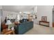 Living room with comfortable seating and views to kitchen at 11196 Ne 227Th Place Rd, Fort Mc Coy, FL 32134