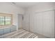 Bedroom with light blue dresser and window at 11196 Ne 227Th Place Rd, Fort Mc Coy, FL 32134