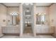 Double vanity bathroom with access to bedroom and hallway at 11196 Ne 227Th Place Rd, Fort Mc Coy, FL 32134
