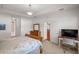 Bright bedroom with large bed and access to bathroom at 11196 Ne 227Th Place Rd, Fort Mc Coy, FL 32134