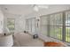 Sunroom with water views and ample natural light at 11196 Ne 227Th Place Rd, Fort Mc Coy, FL 32134