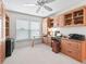 Home office with built-in cabinetry and a workspace at 3812 Nottingham Loop, The Villages, FL 32163