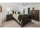 Guest bedroom with a dark wood sleigh bed and ample storage at 3812 Nottingham Loop, The Villages, FL 32163