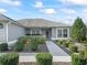 Inviting front entry with landscaped walkway at 3812 Nottingham Loop, The Villages, FL 32163