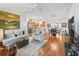Open living room with hardwood floors at 3812 Nottingham Loop, The Villages, FL 32163