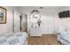 Well-lit bedroom with white furniture and ample closet space at 8881 Sw 94Th St # E, Ocala, FL 34481