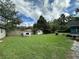 Large backyard with shed and grassy lawn at 5877 Nw 64Th St, Ocala, FL 34482