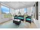 Relaxing sunroom with wicker furniture and view at 10820 Sw 87Th Ter, Ocala, FL 34481