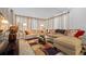Spacious living room with comfy seating and a large area rug at 10820 Sw 87Th Ter, Ocala, FL 34481