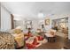 Spacious living room with hardwood floors and a cozy sitting area at 10820 Sw 87Th Ter, Ocala, FL 34481