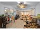 Sunroom boasts ample seating and large windows, creating a relaxing space at 10820 Sw 87Th Ter, Ocala, FL 34481