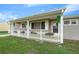 Front porch with white picket fence and flower boxes at 10820 Sw 87Th Ter, Ocala, FL 34481