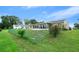 House with a fenced backyard and screened porch at 10820 Sw 87Th Ter, Ocala, FL 34481
