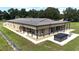 Long, single-story home with covered patio and hot tub at 2051 Se 155Th St, Summerfield, FL 34491