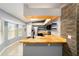 Modern kitchen with butcher block countertops, stainless steel appliances, and wood shelving at 6760 Cherry Rd, Ocala, FL 34472