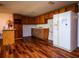 Eat-in kitchen with wood cabinets and vinyl flooring at 24750 Ne 177Th Ter, Fort Mc Coy, FL 32134