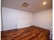 Empty bonus room with wood-look floors at 24750 Ne 177Th Ter, Fort Mc Coy, FL 32134