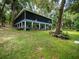 Ranch style home with a large backyard, surrounded by trees at 24750 Ne 177Th Ter, Fort Mc Coy, FL 32134