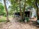 Ranch style home with screened porch, nestled in a lush, wooded setting at 24750 Ne 177Th Ter, Fort Mc Coy, FL 32134