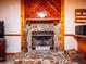 Stone fireplace with wood mantel in the living room at 24750 Ne 177Th Ter, Fort Mc Coy, FL 32134