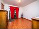 Spacious bedroom with wood flooring and sliding glass doors leading to a patio at 24750 Ne 177Th Ter, Fort Mc Coy, FL 32134