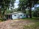 Light blue home with a screened porch and large yard at 24750 Ne 177Th Ter, Fort Mc Coy, FL 32134